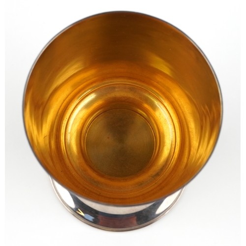 25 - Hector Miller, a silver and gilt Winchester Cathedral 9th centenary goblet raised on a round pedesta... 