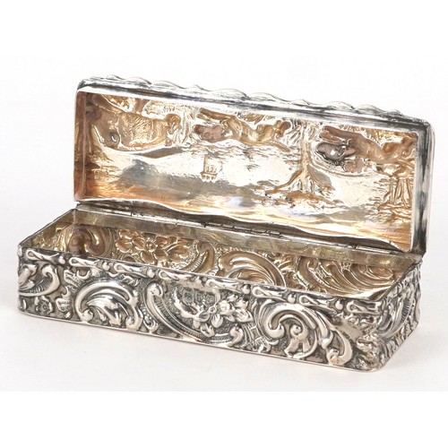 53 - An Edwardian silver hunting interest box, the hinged lid embossed with a hunting scene, Chester 1902... 