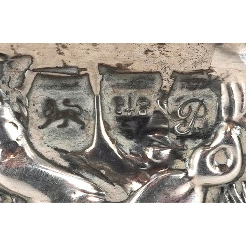 53 - An Edwardian silver hunting interest box, the hinged lid embossed with a hunting scene, Chester 1902... 