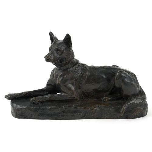 235 - After L Riché, a cold cast bronze study of a recumbent dog, 24cm in length.