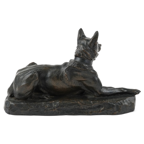 235 - After L Riché, a cold cast bronze study of a recumbent dog, 24cm in length.