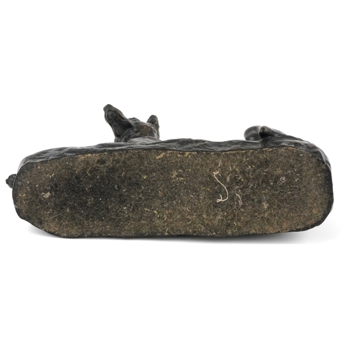 235 - After L Riché, a cold cast bronze study of a recumbent dog, 24cm in length.