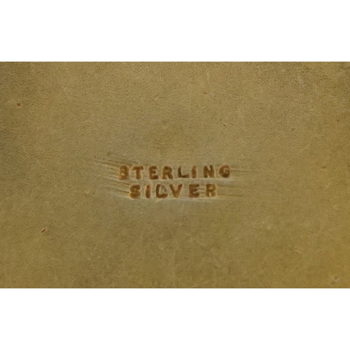 3098 - A sterling silver gilt and enamel pendant hand painted with a soldiers camp before mountains, 3.3cm ... 