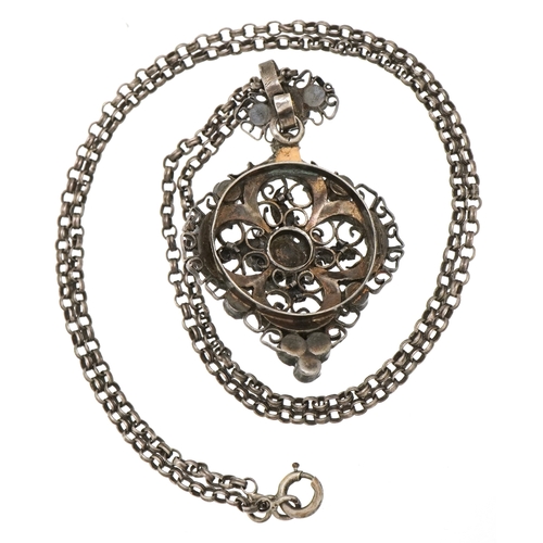  An Austro-Hungarian unmarked silver garnet and seed pearl pendant on a silver necklace, 4.3cm high a... 
