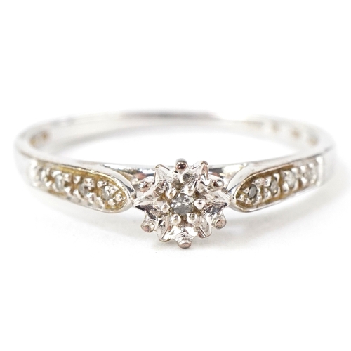 3131 - A 9ct white gold diamond solitaire ring with diamond set shoulders, total diamond weight approximate... 