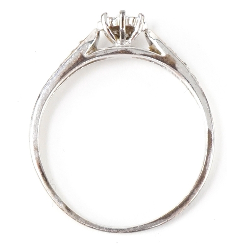 3131 - A 9ct white gold diamond solitaire ring with diamond set shoulders, total diamond weight approximate... 