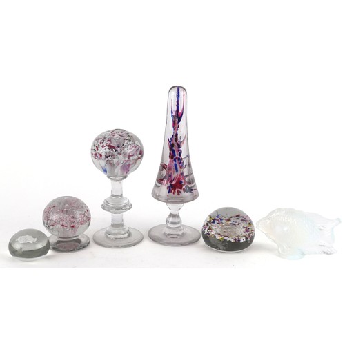 440 - A collection of glass paperweights including footed examples and an opalescent fish, the largest 23c... 