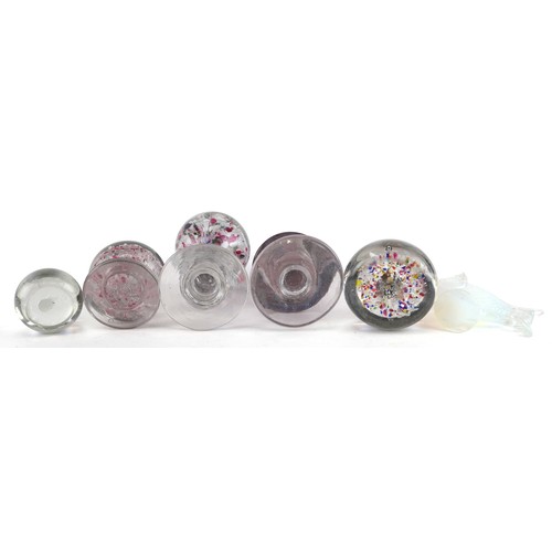 440 - A collection of glass paperweights including footed examples and an opalescent fish, the largest 23c... 