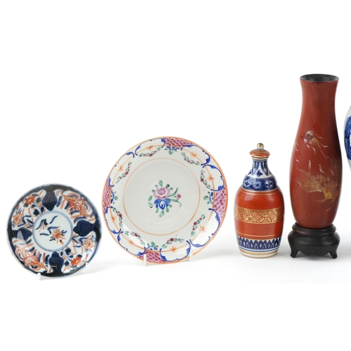 1733 - A collection of Chinese and Japanese porcelain including hand painted dishes, a blue and white balus... 