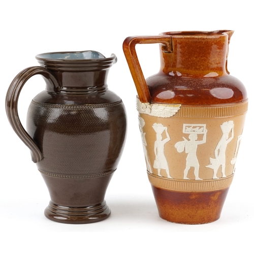 325 - A Doulton Lambeth stoneware jug decorated with Egyptian figures, bearing impressed marks to the base... 
