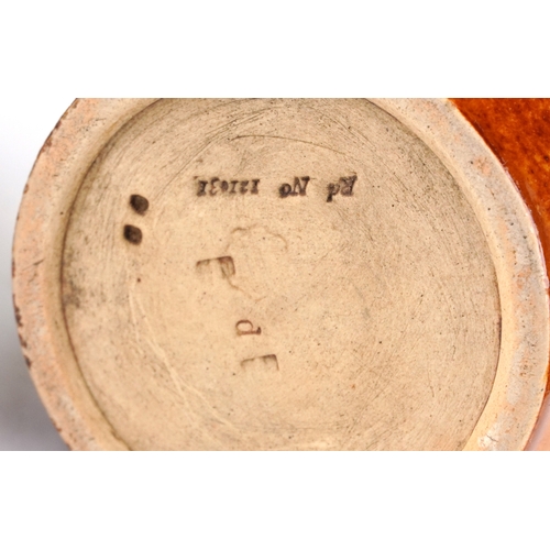 325 - A Doulton Lambeth stoneware jug decorated with Egyptian figures, bearing impressed marks to the base... 