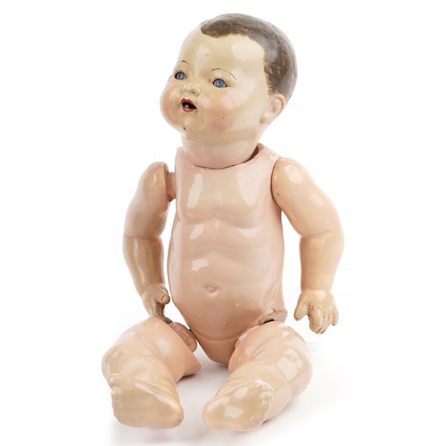 734 - Two early 20th century dolls comprising a German composite doll and a Dutch doll with jointed limbs,... 