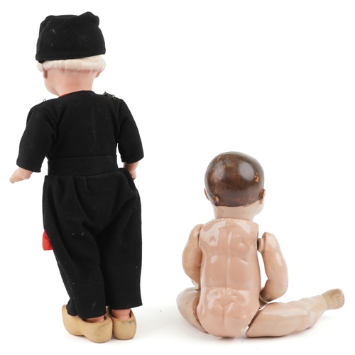 734 - Two early 20th century dolls comprising a German composite doll and a Dutch doll with jointed limbs,... 