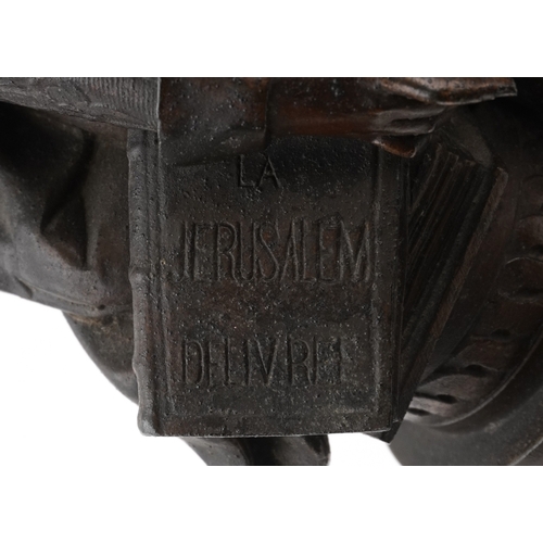 102 - A 20th century bronzed figure of William Shakespeare modelled leaning against a column, on an ebonis... 