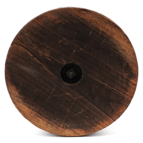 102 - A 20th century bronzed figure of William Shakespeare modelled leaning against a column, on an ebonis... 