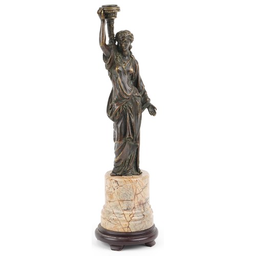 101 - A 20th century brown patinated bronze table lamp base in the form of a maiden carrying a torch, moun... 