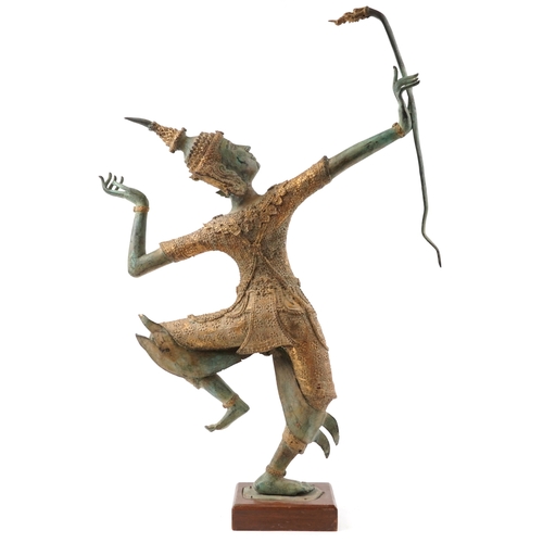  A Taiwanese green and gilt patinated bronze sculpture of an archer, late 20th century, mounted on a ... 
