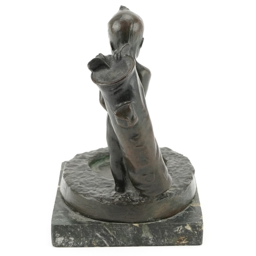 233 - A 20th century golfing interest bronze figure of a Putto with golf clubs, raised on a marble base, 1... 