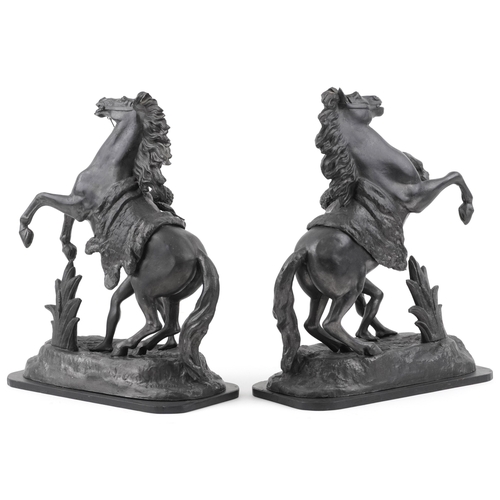 104 - A pair of late 20th century bronzed spelter Marly horses, each mounted on an ebonised plinth base, 4... 