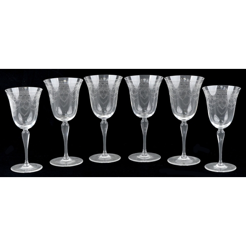 1750 - A set of four engraved wine glasses together a pair of smaller examples, the largest 23cm high.
