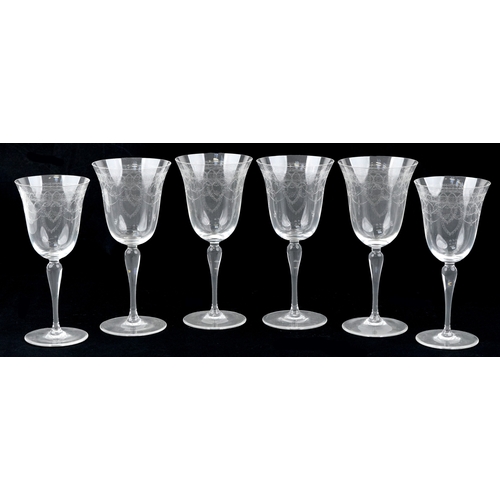 1750 - A set of four engraved wine glasses together a pair of smaller examples, the largest 23cm high.