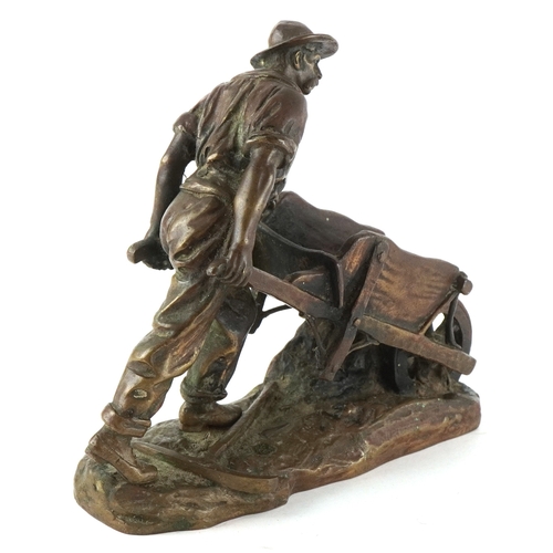 232 - After Émile Carlier, a bronze figure of a miner with wheelbarrow, 7cm high.