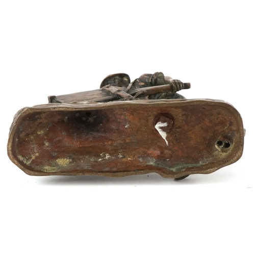 232 - After Émile Carlier, a bronze figure of a miner with wheelbarrow, 7cm high.