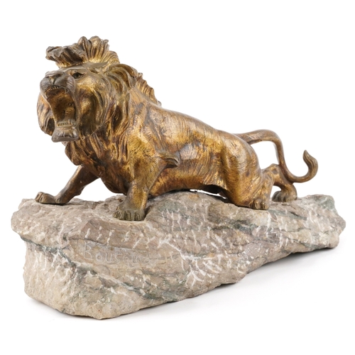 105 - Robert Bousquet (1894-1917) - A French gilt patinated bronze roaring lion mounted on a stone base, s... 