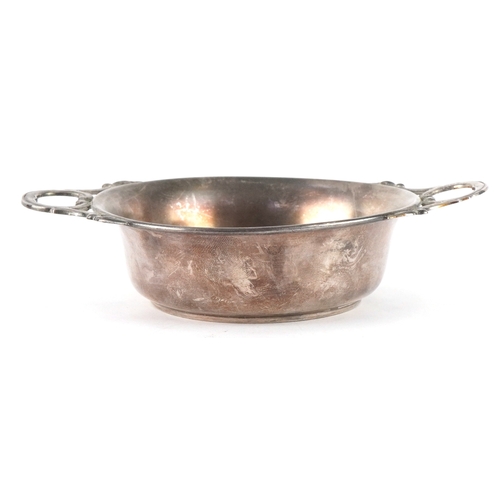 3702 - A silver quaich with twin handles and engraved monogram, 4cm high x 15cm wide, 69.8g.