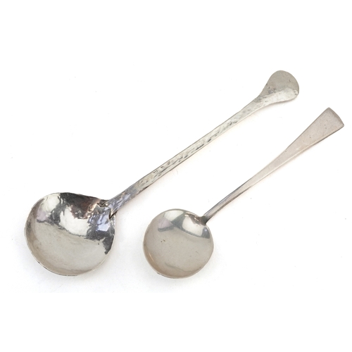 3699 - Two early 20th century silver spoons including a planished example, London 1928, the largest 12.9cm ... 