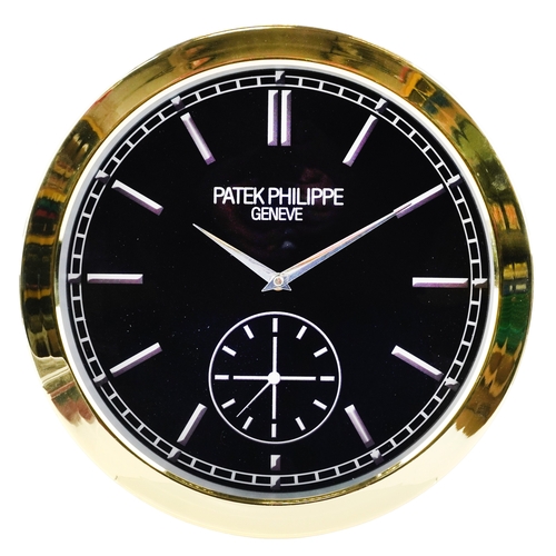 1443 - A Patek Philippe design dealer's display wall clock, 40cm in diameter.