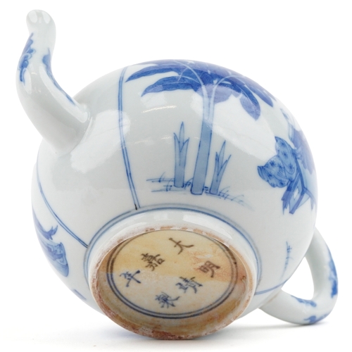 195 - A Chinese blue and white porcelain teapot hand painted with a mother and children playing, six figur... 