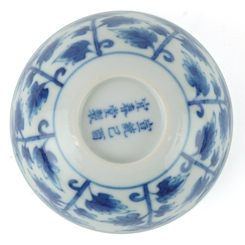 199 - A Chinese blue and white porcelain rice bowl hand painted with stylized flowers, eight figure charac... 