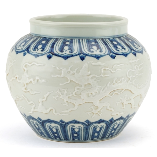 350 - A Chinese blue and white porcelain jardinière decorated in relief and incised with dragons, 20cm hig... 
