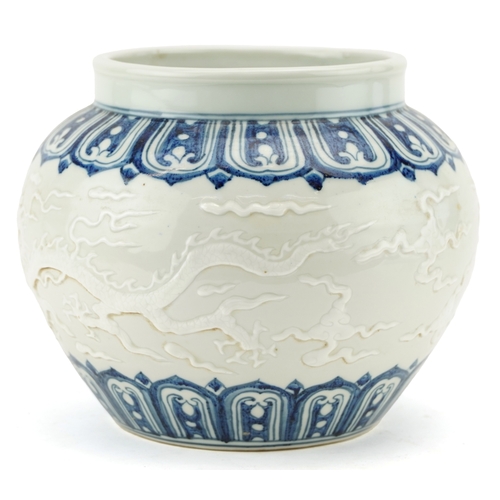 350 - A Chinese blue and white porcelain jardinière decorated in relief and incised with dragons, 20cm hig... 
