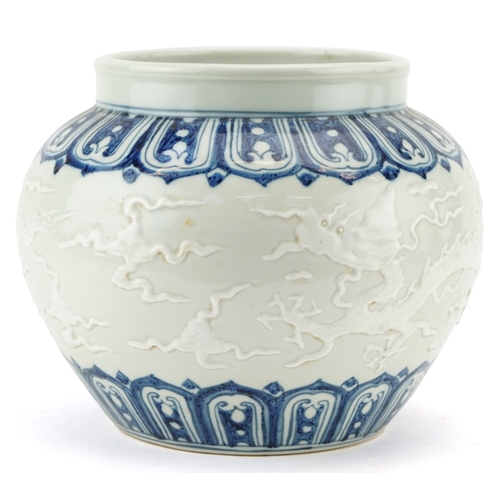 350 - A Chinese blue and white porcelain jardinière decorated in relief and incised with dragons, 20cm hig... 