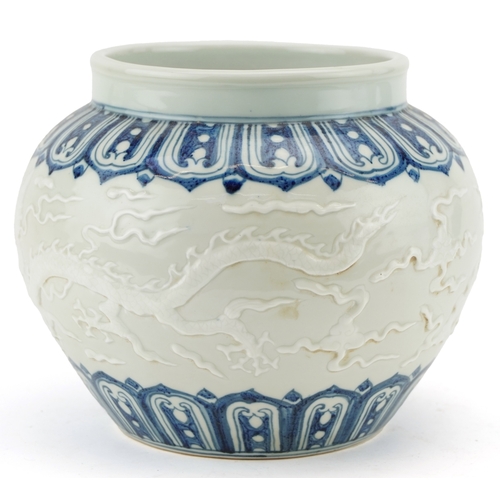 350 - A Chinese blue and white porcelain jardinière decorated in relief and incised with dragons, 20cm hig... 