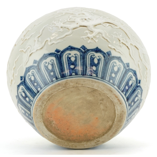 350 - A Chinese blue and white porcelain jardinière decorated in relief and incised with dragons, 20cm hig... 