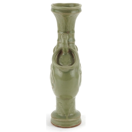 351 - A Chinese porcelain celadon glazed vase with ring turned handles decorated in relief with mythical a... 