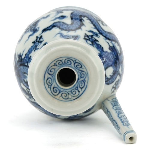 136 - A Chinese blue and white porcelain ewer hand painted with dragons amongst clouds, six figure charact... 