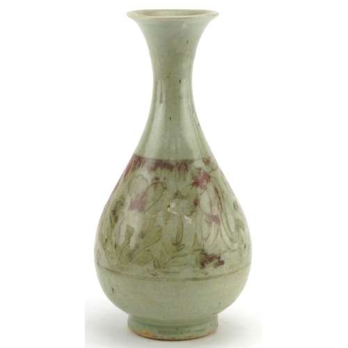 192 - A Chinese porcelain bottleneck vase having a celadon and sang de boeuf glaze, incised with a continu... 