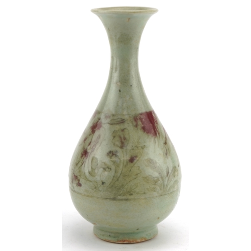 192 - A Chinese porcelain bottleneck vase having a celadon and sang de boeuf glaze, incised with a continu... 