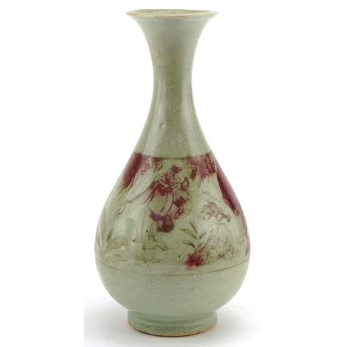 192 - A Chinese porcelain bottleneck vase having a celadon and sang de boeuf glaze, incised with a continu... 