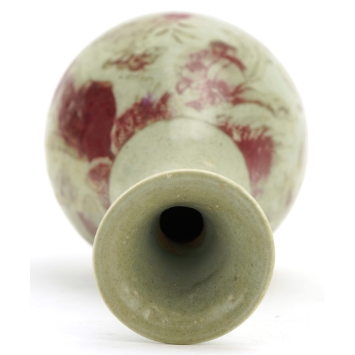 192 - A Chinese porcelain bottleneck vase having a celadon and sang de boeuf glaze, incised with a continu... 