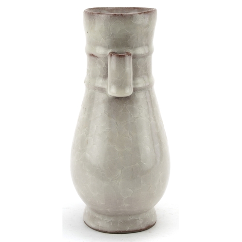 194 - A Chinese porcelain crackle glazed vase with ears, 12cm high.