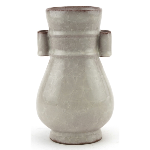 194 - A Chinese porcelain crackle glazed vase with ears, 12cm high.