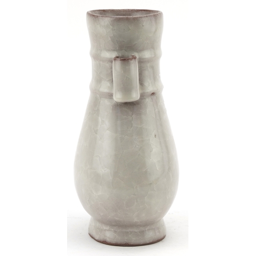 194 - A Chinese porcelain crackle glazed vase with ears, 12cm high.