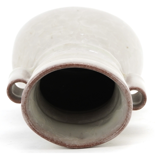 194 - A Chinese porcelain crackle glazed vase with ears, 12cm high.