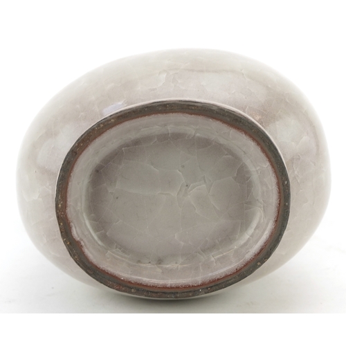 194 - A Chinese porcelain crackle glazed vase with ears, 12cm high.
