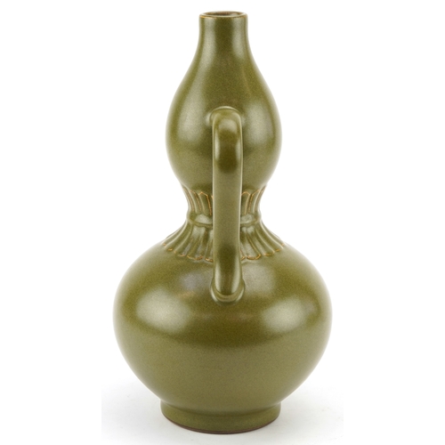 193 - A Chinese porcelain teadust glazed double gourd vase with twin handles, six figure character marks t... 